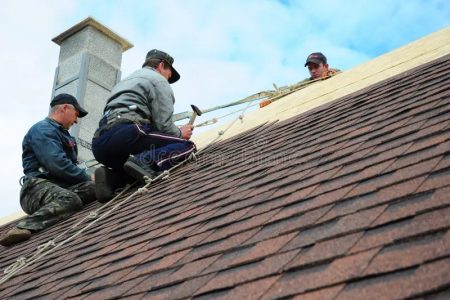 imgi_195_roofing-construction-contractors-install-new-house-asphalt-shingles-roofers-safety-rope-contractor-kiev-ukraine-january-104242960